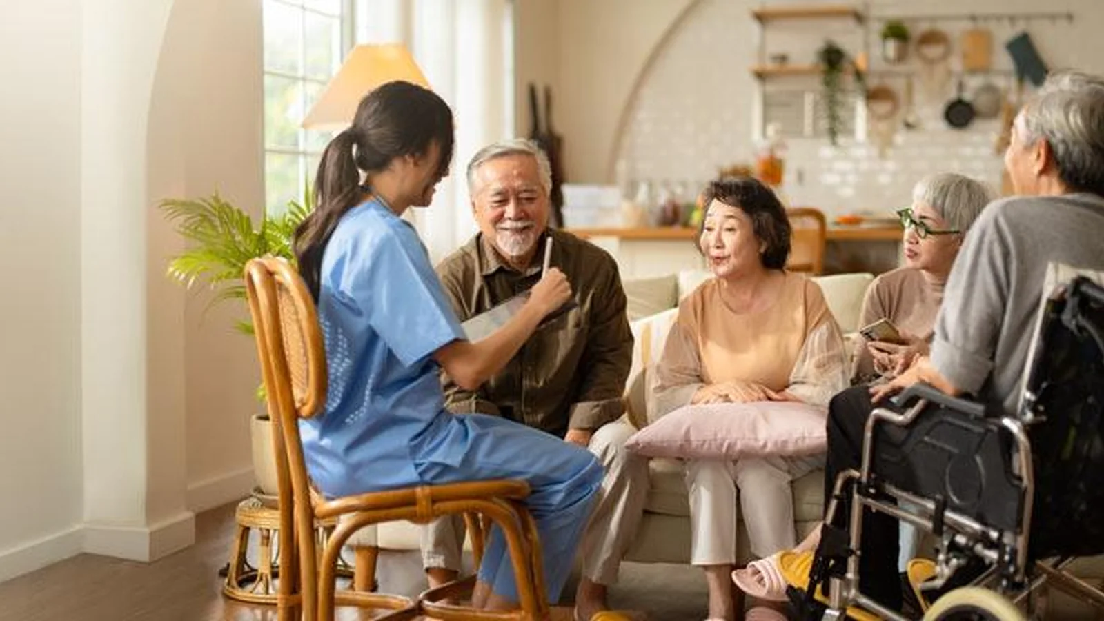 Home health nurse meeting with a multigenerational family in their home